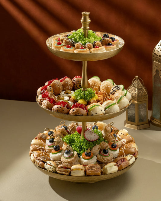Three-tiered tray of assorted pastries 